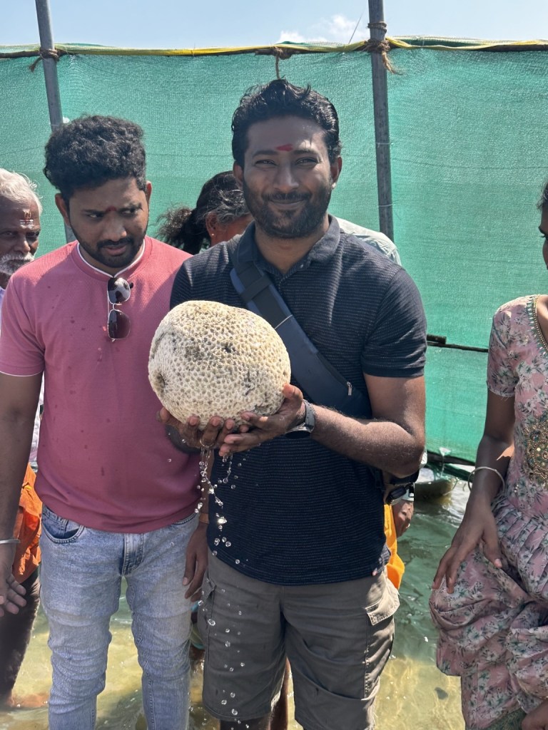 Thana holding the porous stone in Rameswaram