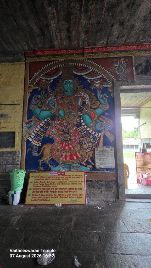 Colourful devotional painting on a stone wall inside Vaitheeswaran Temple