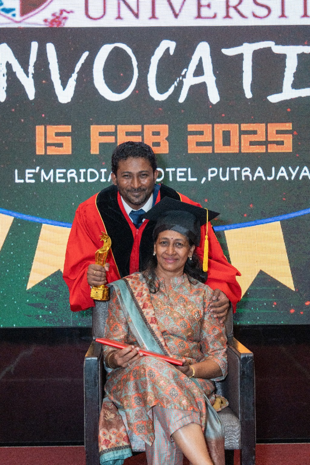 Thana with his mum at his MBA convocation