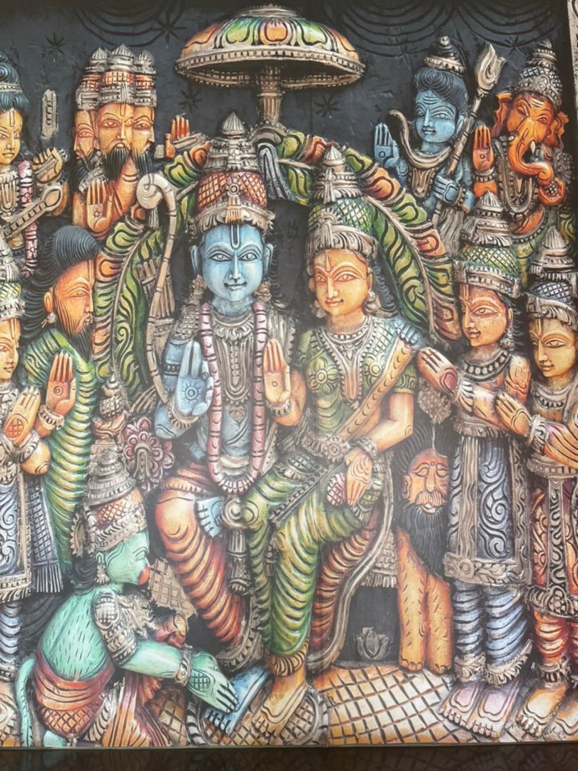 Colourful artwork depicting Rama and Sita with other deities