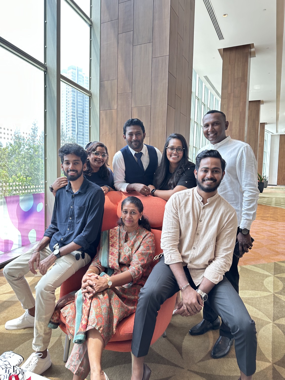Thana celebrating graduation with his mum and guests