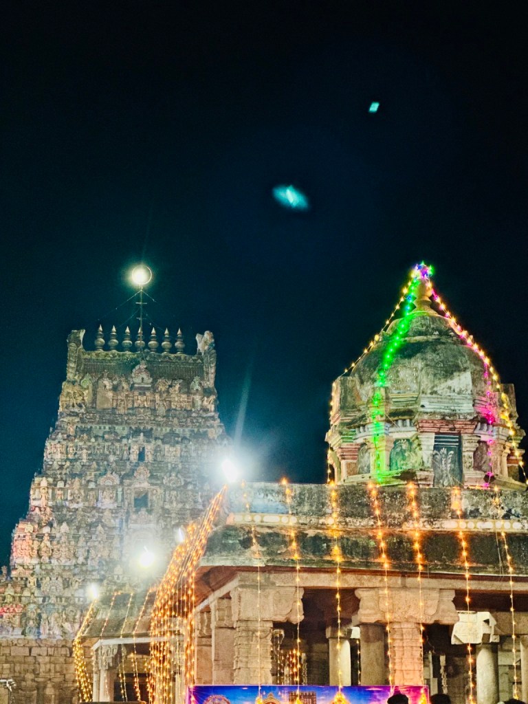 Temple towers illuminated at night