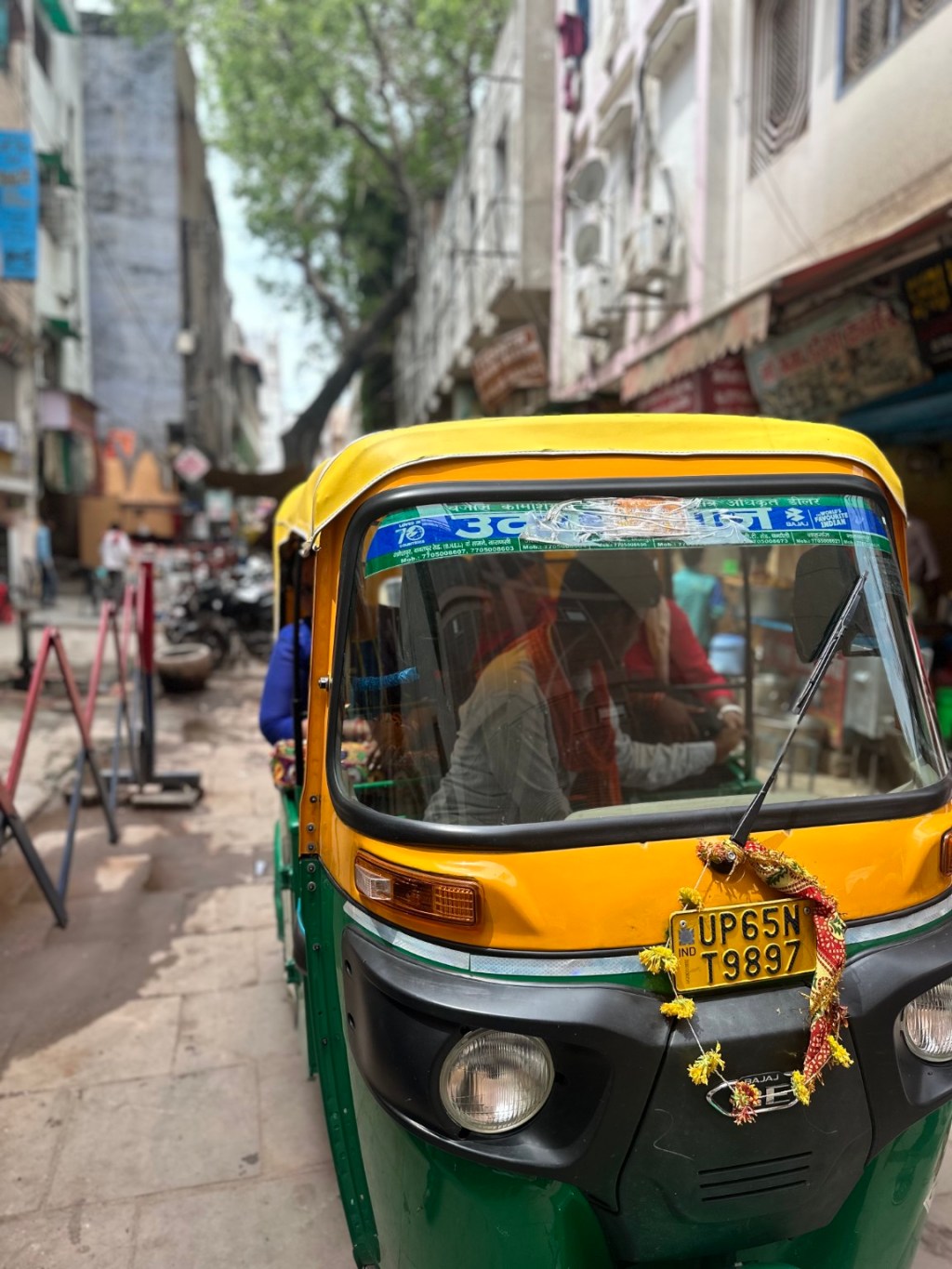 An auto-rickshaw in a narrow street in Kashi.