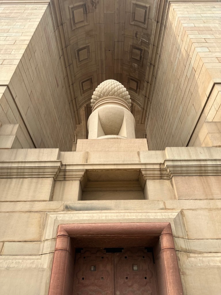 Stonework viewed from beneath the arch of India Gate